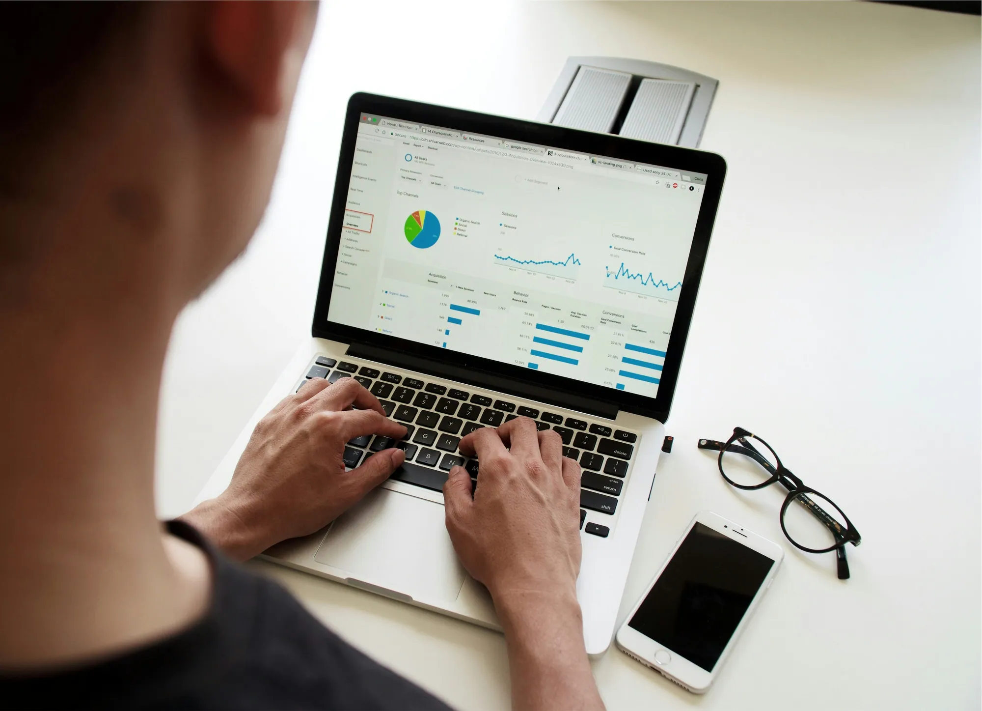 Person reviewing analytics dashboard on laptop