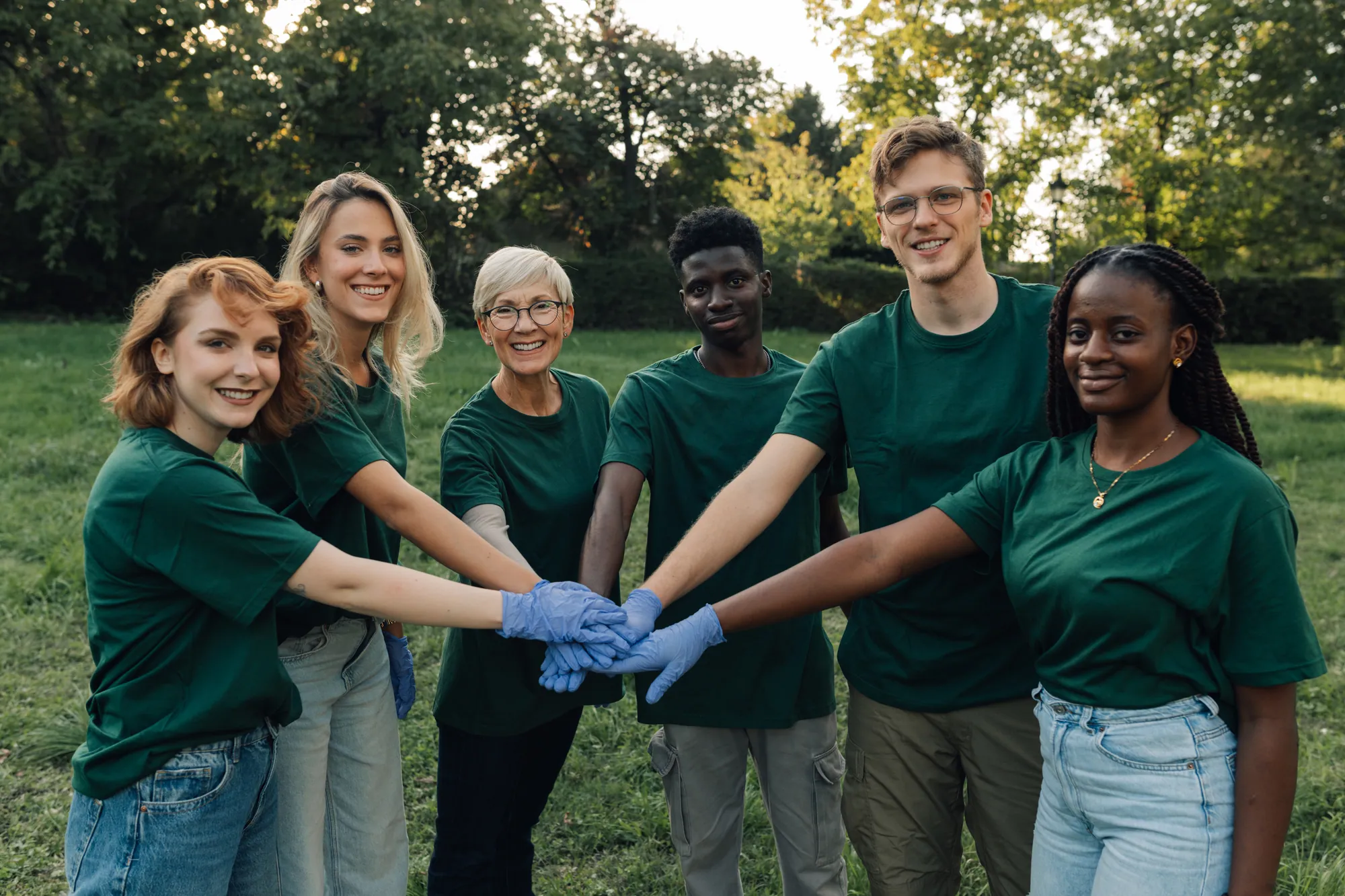 Volunteers joining hands together