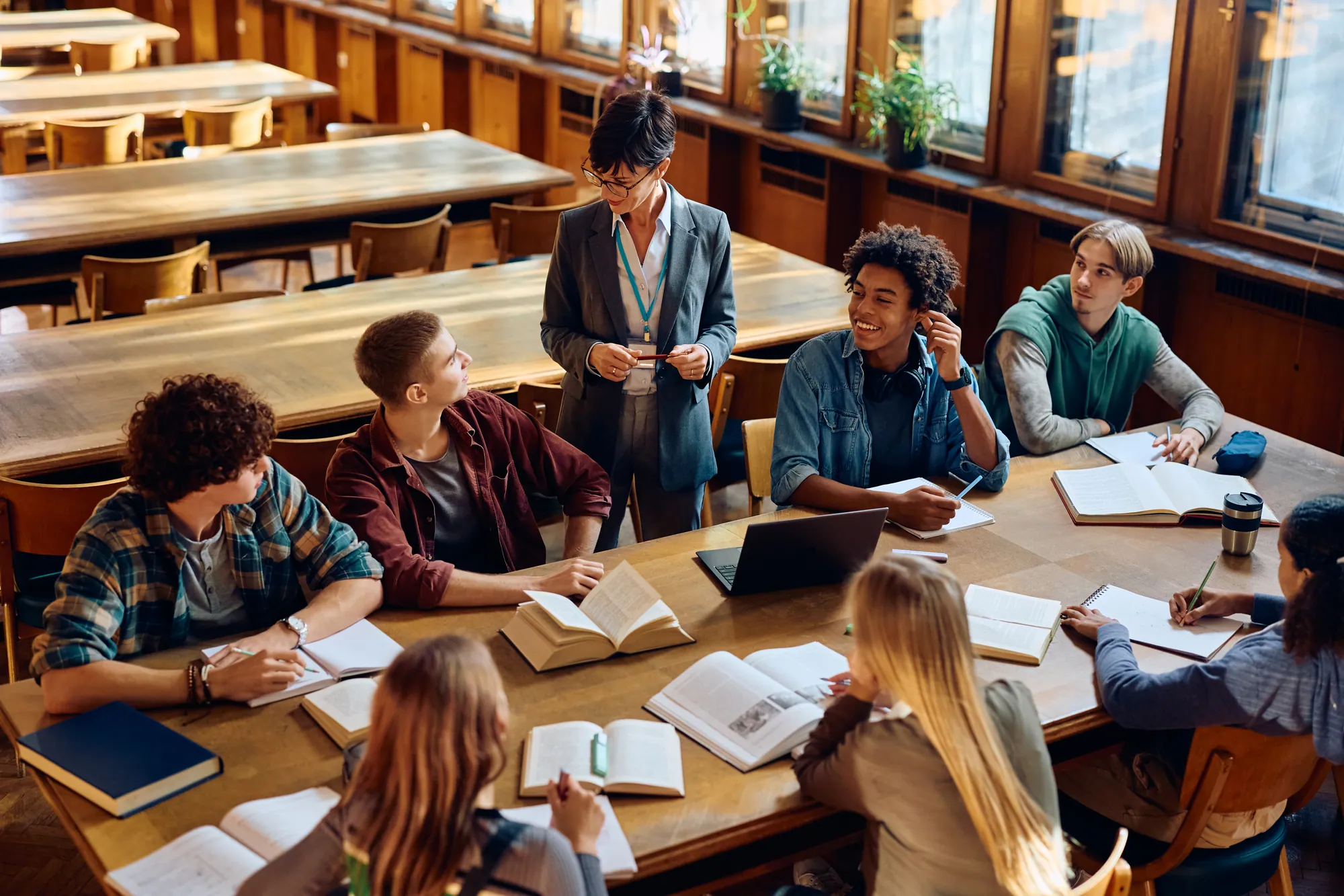 Teacher engaging with high school students