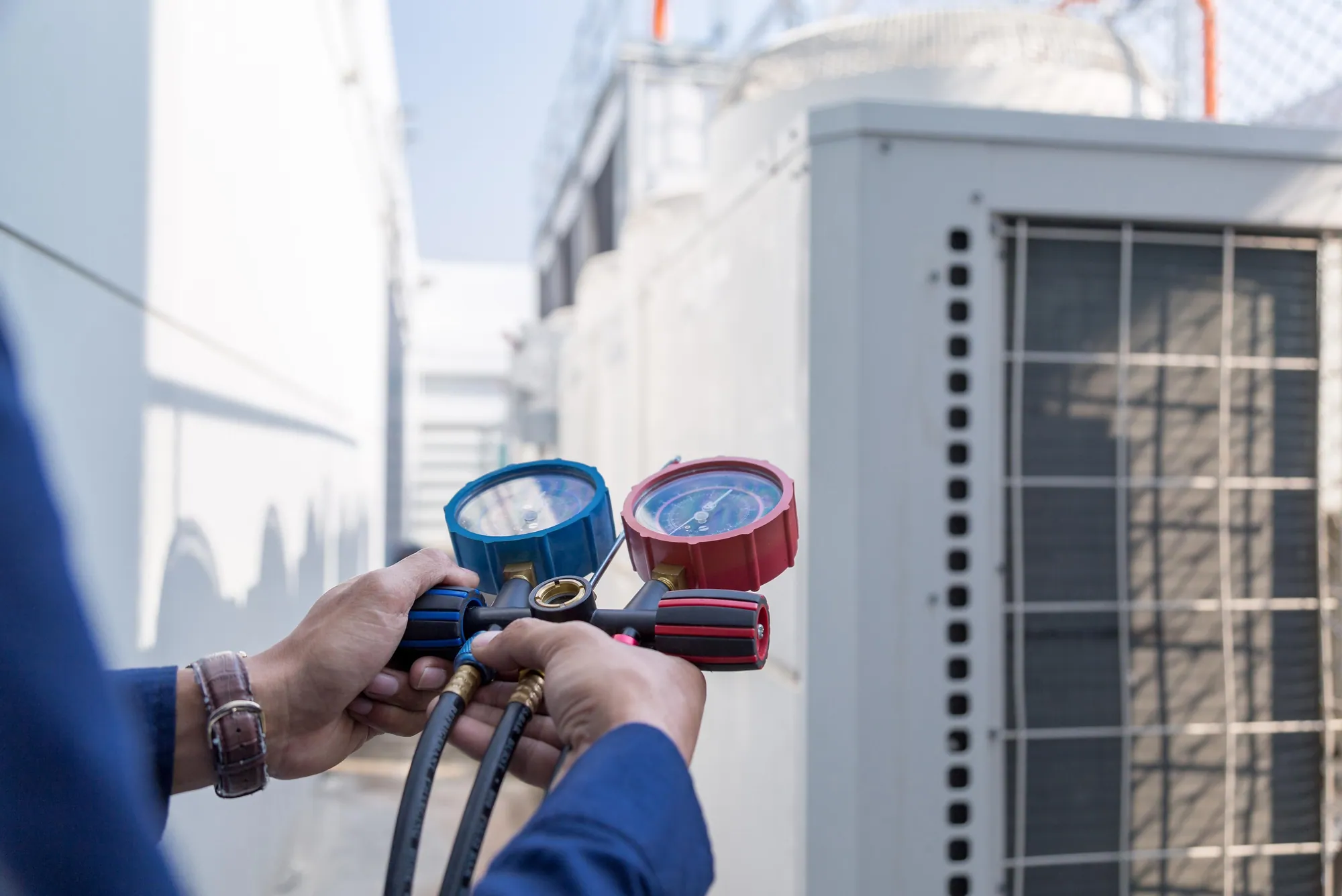 HVAC technician checking system pressure