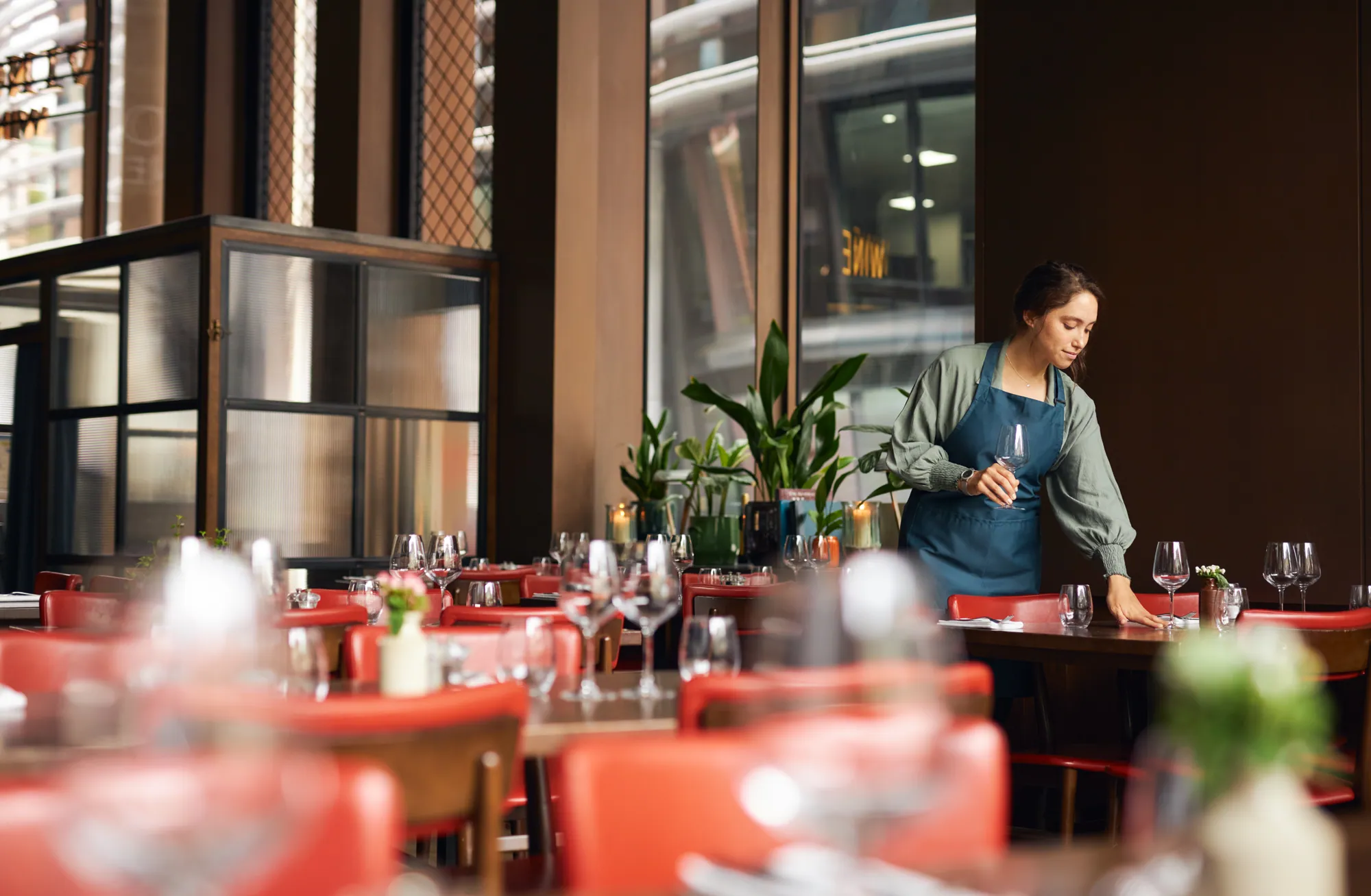 Restaurant server setting a fine dining table